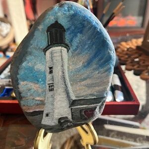 Freehand painting of the Famous Scituate Lighthouse on a beach stone